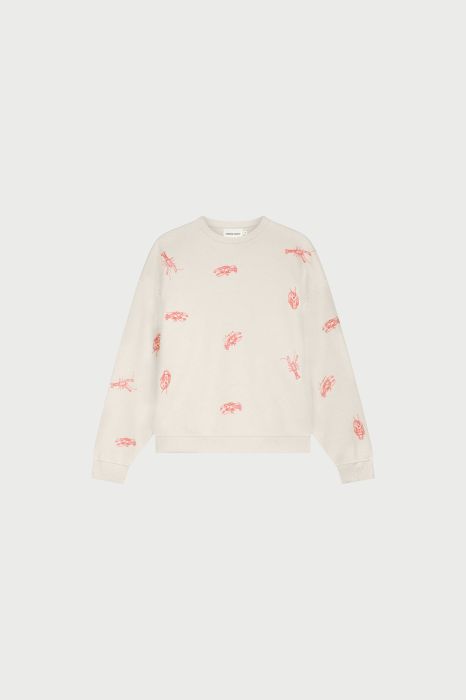 Ecru sweater van Fabienne Chapot model CLT-SWE-20-SS26-1507 met rode kreeftprint ronde hals en ribboorden