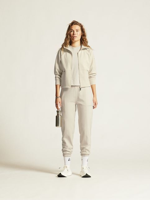 Crèmekleurig Craft trainingspak model 1914703 214000 met ritssluiting hoge kraag en jogger met elastische boorden